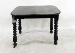 Dark stained oak dining table on bobbin turned sup