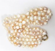 LOT WITHDRAWN Three-strand champagne and cream baroque pearl necklace with gold coloured metal