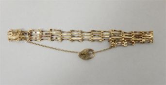 9ct gold four-bar gate bracelet with padlock clasp