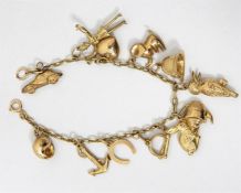 9ct gold charm bracelet, the chain set with 12 cha