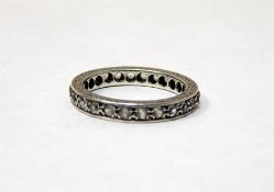 White coloured metal and white stone full eternity