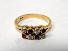9ct gold, diamond and ruby dress ring set with fou