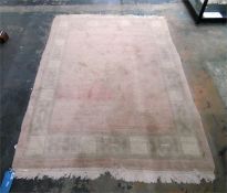 Modern wool rug with white ground, central lozenge