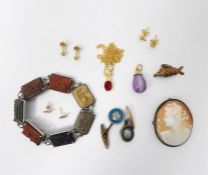 Carved lava cameo and silver-coloured metal bracel