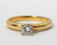 Gold and diamond solitaire, the circular cut diamo