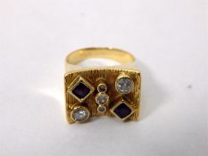 Modern gold-coloured metal ring set with pink ston