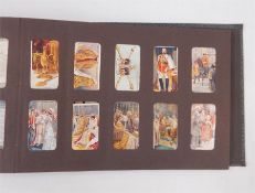 Quantity of cigarette card albums including Wills, The London Cigarette Card, Ogdens, etc (1 box)