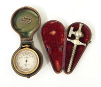 J B Winter, Newcastle on Tyne pocket barometer in case and a winder in case (2)