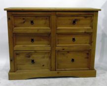 Modern chest of six drawers with black painted metal ring handles and plinth base, 133cm wide