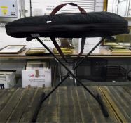 Yamaha keyboard with its stand