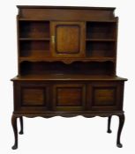 Early 20th century oak dresser, the superstructure having display shelves and central cupboard