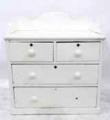 Victorian white painted pine chest of drawers with raised splash back, two short and two long