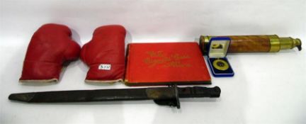 Pair of 6oz boxing gloves, a telescope, a bayonet,
