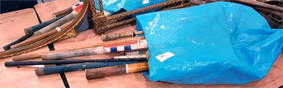 Various vintage tennis racquets, a cricket bat, a lacrosse stick and teddy bear