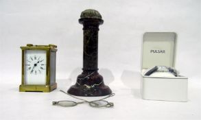 19th century brass carriage clock with enamel dial, a polished stone column (possibly wig stand),