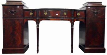Mahogany twin-pedestal breakfront sideboard, the caddy topped pedestals enclosed by a door with