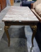 Rectangular marble topped coffee table on a gold s