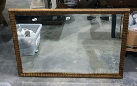 Bevelled plate wall mirror within a gilt moulded f