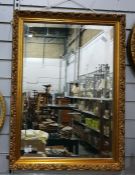 Rectangular bevelled plate wall mirror within a mo