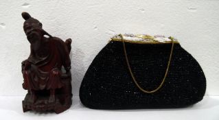 Carved wood Chinese figure of man seated upon bask