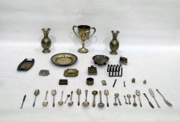 Silver plate trophy cup, a pair of white metal Eas