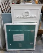 Wall mirror within a white painted frame and appli