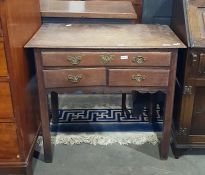 Early 19th century oak side table having an arrang