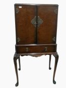 Early 20th century walnut cocktail cabinet with tw