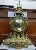 French mantel clock in a gilt metal case, with str