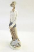Lladro figure of medieval style with fencing foil and pile of books, 30cm high (damaged) and a