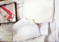 Three damask tablecloths, assorted linen and damask napkins, a set of boxed hankies, three other