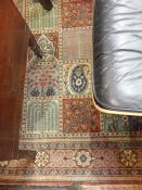 Persian style wool rug. five rows of nine bordered squares depicting boteh, trees and arches