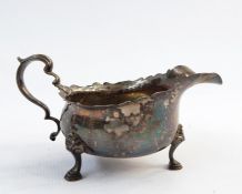 Early 20th century silver sauceboat raised upon three feet, Birmingham 1937, F C Richards and a 20th