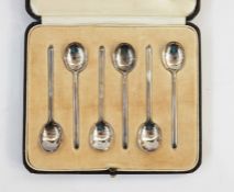 Set of six silver coffee spoons, slip top, Sheffield assay, in case and an Edwardian card case,