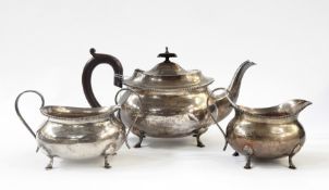 Silver three-piece teaset of shaped rectangular form with bead border, on four hoof feet, Birmingham