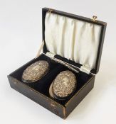 Gentleman's silver brush and comb set with repousse decoration, boxed