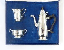 Early Georgian style silver coffee service including coffee pot, milk jug and sugar bowl, scroll