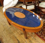 20th century custom made oval coffee table finished in oak, with central oval ostrich skin panel