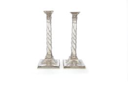 A pair of George III silver columnar candlesticks by Tudor & Leader (Henry Tudor & Thomas Leader)