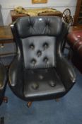 1960's/70's Black Vinyl Swivel Armchair with Teak