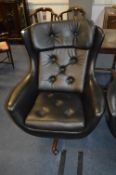 1960's/70's Black Vinyl Swivel Armchair with Teak