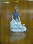 Nao Figurine - Young Girl Teaching Puppies