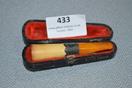 Cased Cheroot with Amber Stem and Silver Band