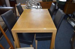 Light Oak Dining Table and Four Leatherette Dining