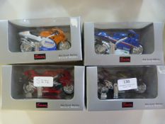 Four Saico Diecast Model Motorcycles