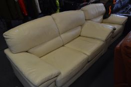 Cream Leather Two Piece Suite; Two Seat Sofa and a