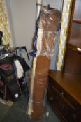 Three Rolls of Brown and Floral Patterned Material