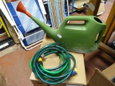 Plastic Watering Can and a Small Length of Hose