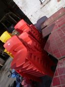 Twenty Six Red Plastic Chairs