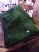 *Two Sections of Artificial Grass